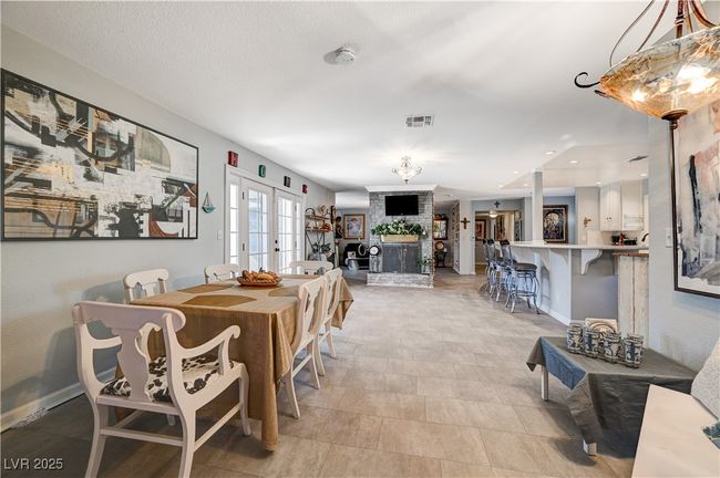 Dining room with french doors, baseboards, and recessed lighting | Image 26