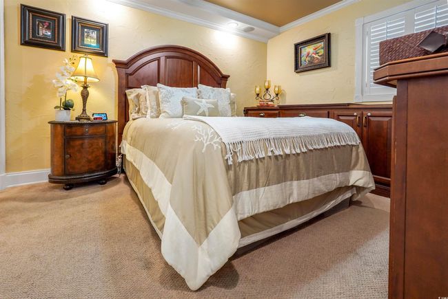 Bedroom featuring ornamental molding and carpet floors | Image 23