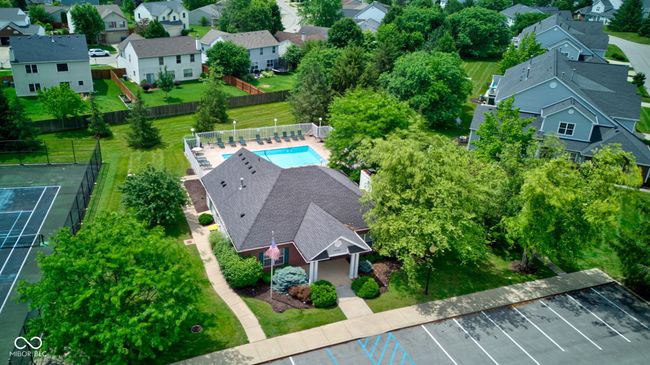 aerial perspective of suburban area featuring a pool | Image 4