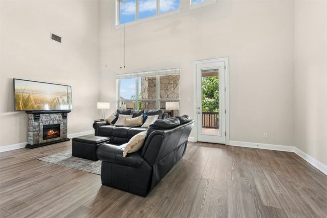Beautiful two story living room with windows and light. Perfect for large gatherings. | Image 9