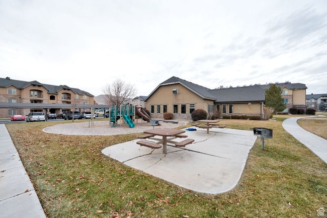 Rear view of house featuring a lawn and a residential view | Image 17