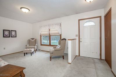 Foyer with light carpet | Image 2