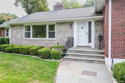 View of exterior entry featuring a lawn | Image 3