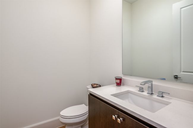 Guest half bath to the left of study | Image 30