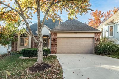 View of front of house featuring a garage | Image 1