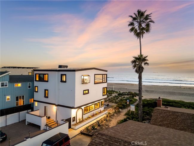 Enjoy the ease of beachfront parking, with direct access to the sand and sweeping views of the coast. | Image 51