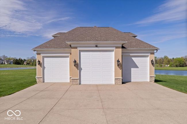 Newly added 54x50 Carriage House. 2700 sq ft for vehicles and/or boats and another 2700 sq ft upstairs that could be built out for additional living space. | Image 50