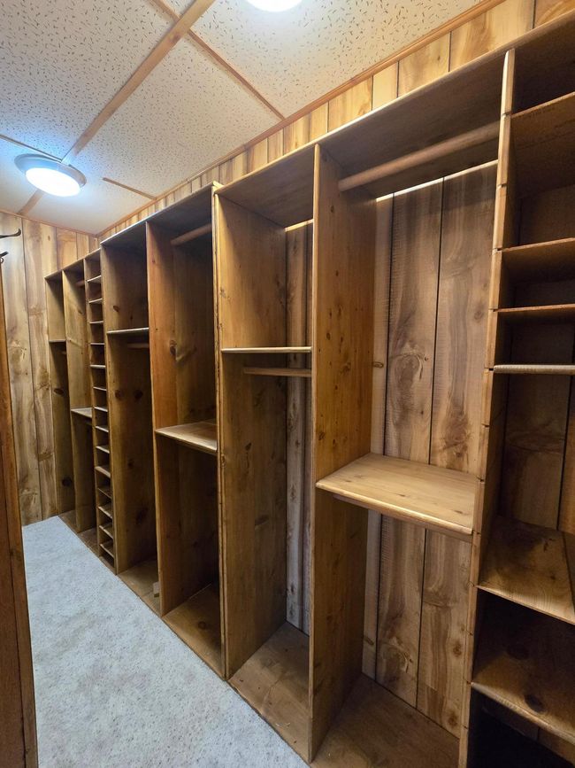 Large walk in closet with plenty of built in shelving | Image 39