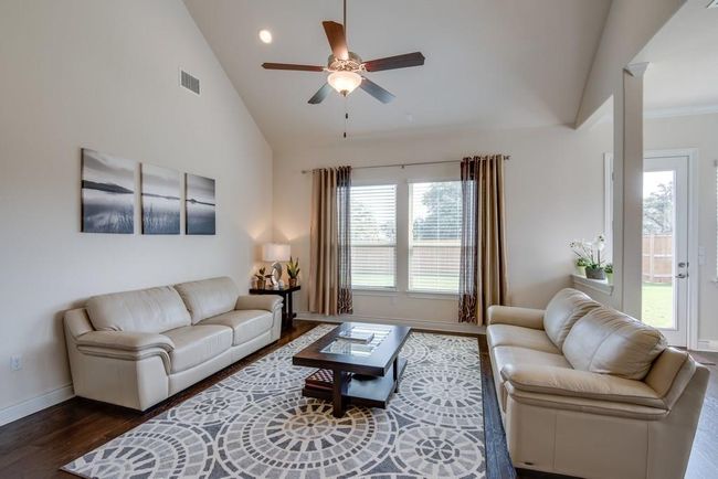Living area featuring visible vents, wood finished floors, baseboards, ceiling fan, and recessed lighting | Image 9