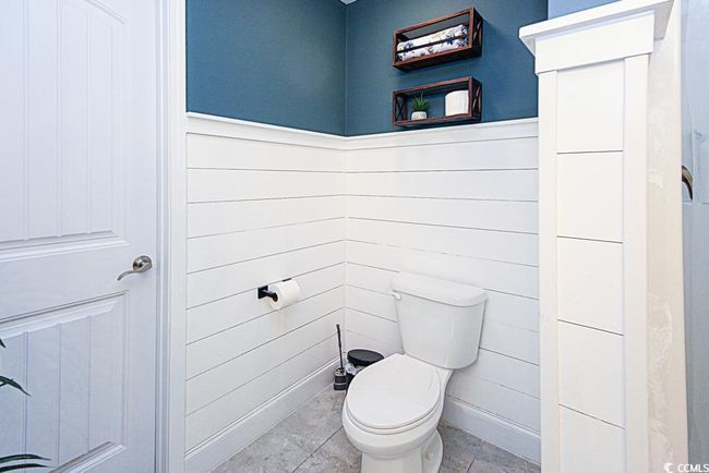Bathroom with tile patterned floors and toilet | Image 21