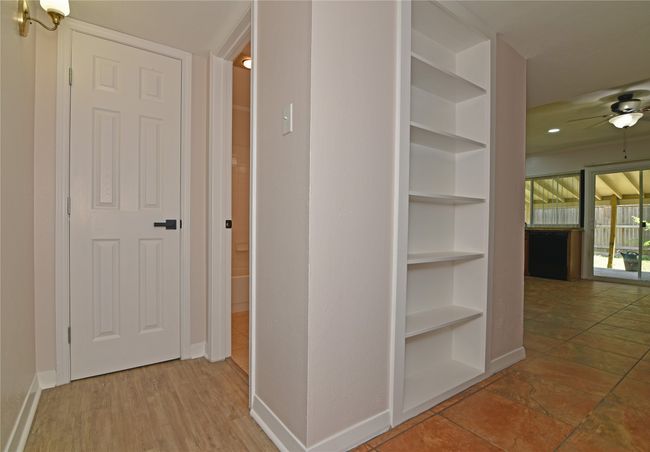 Hallway with built in shelves and baseboards | Image 8