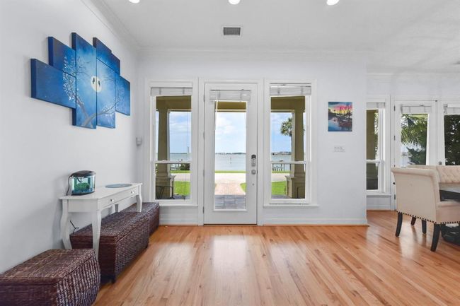 Upon entry, the dining area seamlessly flows into the kitchen on the left. | Image 9