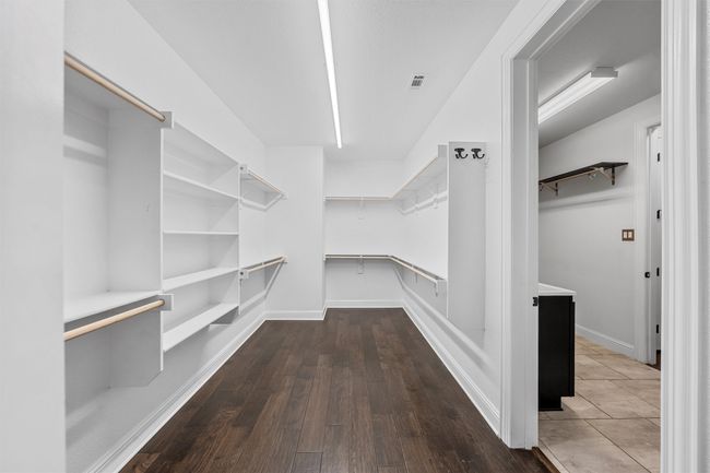 Walk in closet with wood finished floors | Image 20