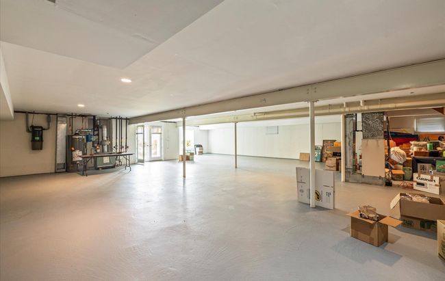 Below grade area featuring gas water heater, a central vacuum unit, and recessed lighting | Image 34