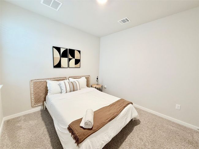 Bedroom with baseboards, carpet flooring, and visible vents | Image 29