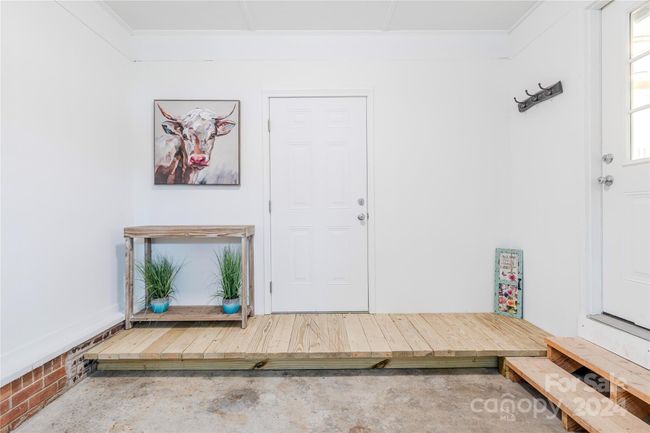 Garage was insulated, drywalled and painted to act as potential space to expand into for additional living space in the future. | Image 35