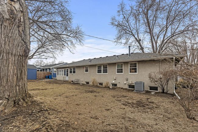 Spacious backyard is a wonderful blank canvas for a green thumb, or fun outdoor activities and entertaining. | Image 26
