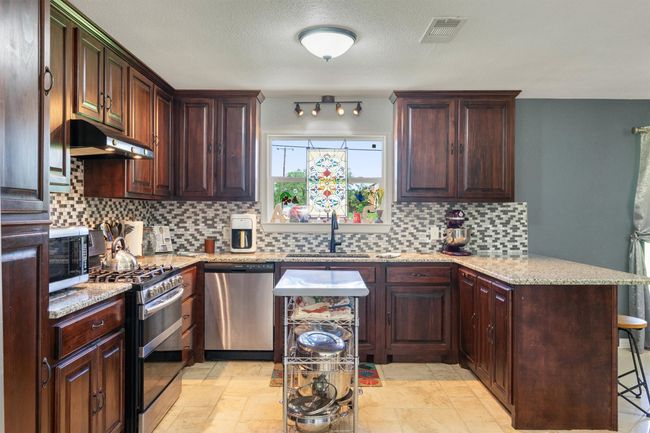 So much space to create amazing meals to share with family and friends. Love the window! | Image 11