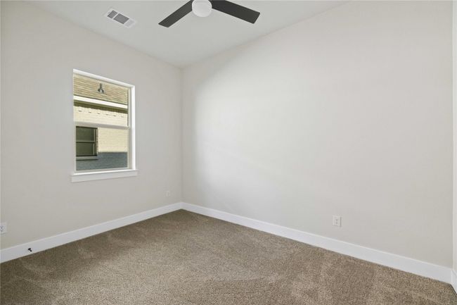 Empty room featuring dark carpet and ceiling fan | Image 25