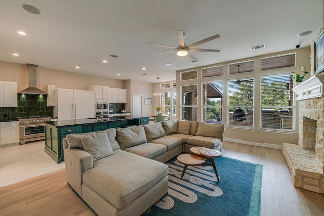 Open living and kitchen that has been extensively updated with designer finishes! | Image 4