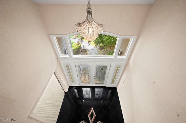 Detailed view of a chandelier and french doors | Image 19