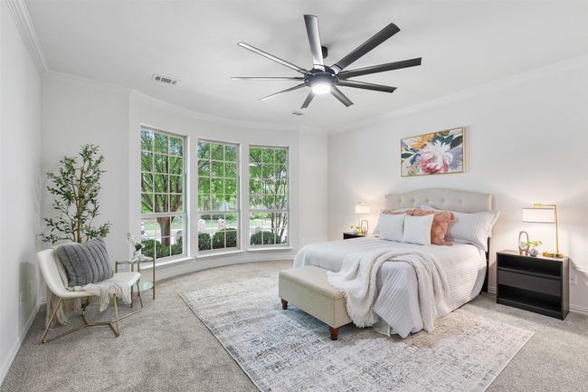 Carpeted bedroom with baseboards, visible vents, ceiling fan, and crown molding | Image 18