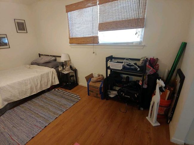 Bedroom with wood finished floors | Image 12