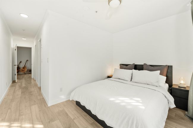 Bedroom with ornamental molding, recessed lighting, baseboards, and light wood finished floors | Image 16