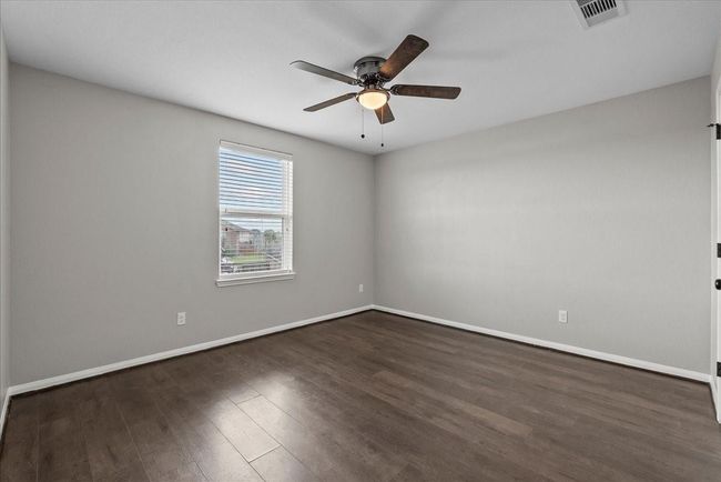 Flexibility is key! This second bedroom effortlessly adapts to your evolving lifestyle needs. | Image 23