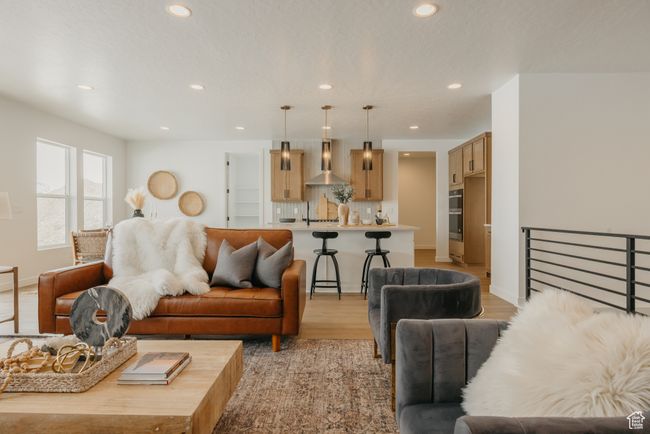 Living room featuring recessed lighting, light wood-style flooring, and baseboards | Image 23