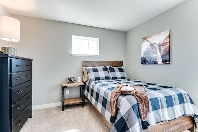 The home's upper level also features a pair of secondary bedrooms, each located just steps from an adjacent full bathroom! Photo of model home, color and options will vary. | Image 31