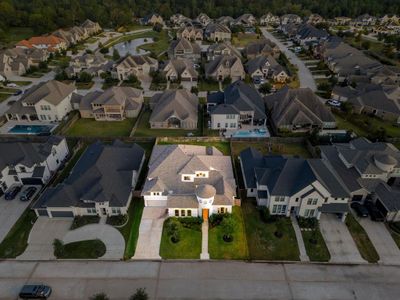 Amazing aerial shot of this gorgeous Coventry home situated on a large lot on a quiet street in the sought after gated community of Bridlecreek zoned to Cy-Fair ISD. Lush landscaping, well manicured front lawn and a wonderful back covered patio. | Image 2