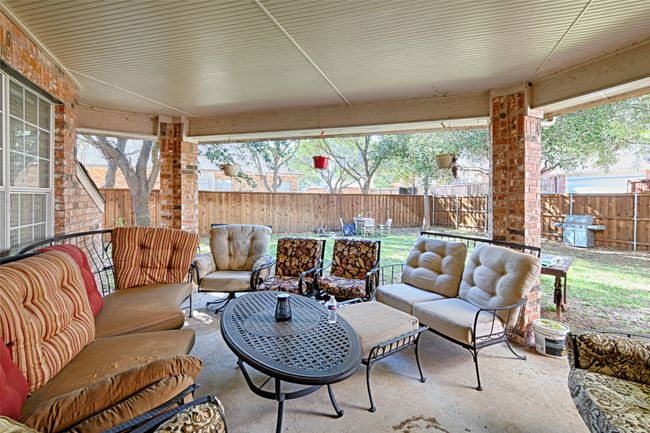 View of patio / terrace featuring a fenced backyard and an outdoor hangout area | Image 37
