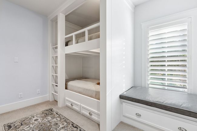 Bedroom with light carpet and baseboards | Image 26