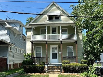 View of front of home featuring a balcony and a porch | Image 1