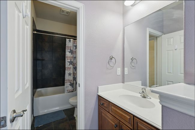 Bedroom with light carpet, a closet, and ceiling fan | Image 30