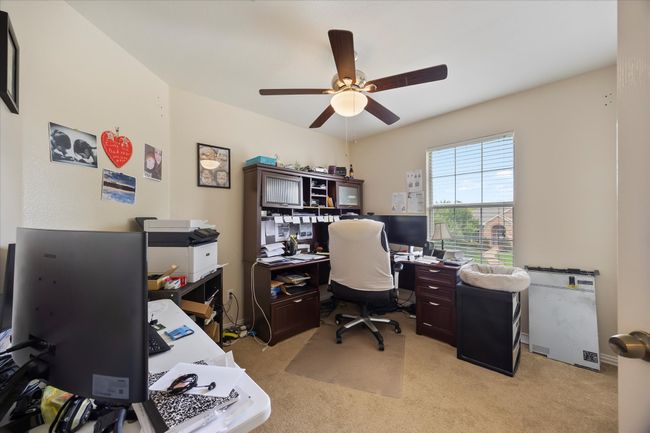 Office area with ceiling fan and light colored carpet | Image 19