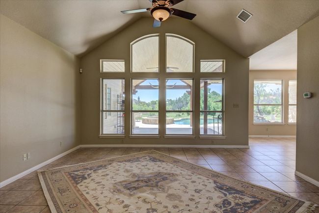 Living room view of the pool, peeks into the chef's kitchen | Image 5