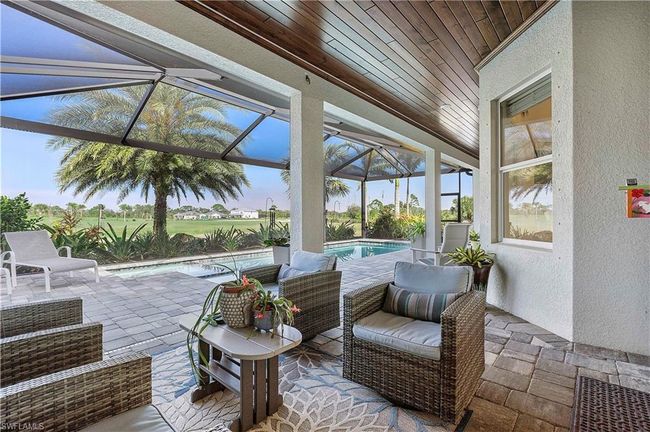 Sunroom featuring visible vents and wood ceiling | Image 21