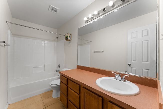 Upstairs Bathroom featuring tile patterned floors, vanity, and shower / tub combination | Image 24