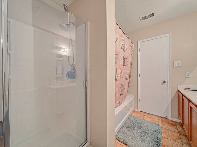 Full bath with tile patterned floors and vanity | Image 13