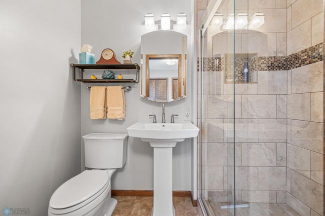 Primary bedroom updated bath | Image 36