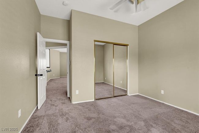 Unfurnished bedroom with carpet flooring and a closet | Image 31