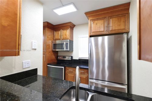 f-909 Twin Lakes Dr, Coral Springs, FL, 33071-5313 | Card Image
