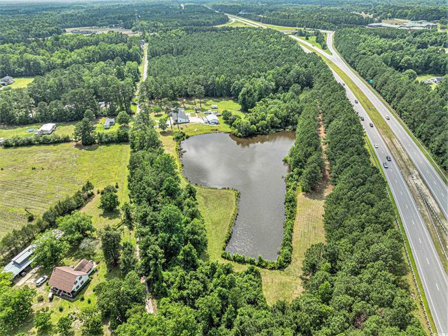 Aerial view of a large body of water and a major roadway | Image 39