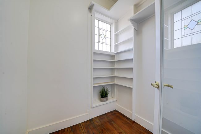 Spacious closet with dark hardwood / wood-style flooring | Image 13