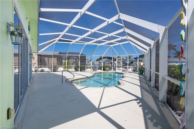 Pool featuring a patio and a lanai | Image 17