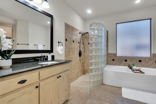 Full bathroom featuring vanity, a bath, walk in shower, tile patterned floors, and recessed lighting | Image 16