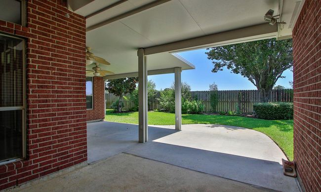 Incredible covered outdoor space with space for multiple seating areas! | Image 31