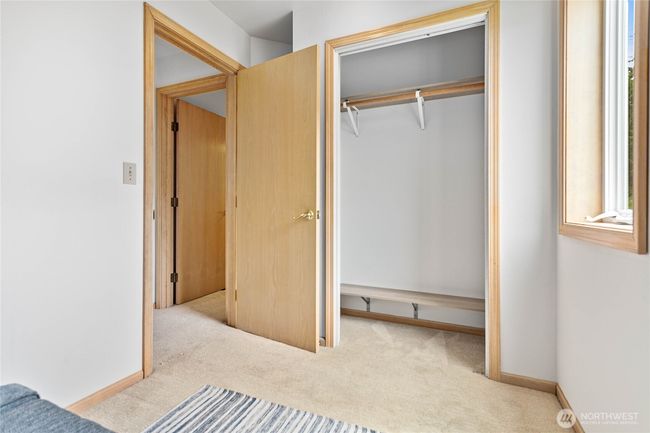 Large walk in closet ideally located between the Primary bedroom and bathroom. | Image 18